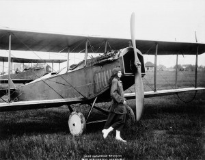 Posing with her Stinson-built Curtiss biplane after the war, in which she famously delivered the mail in the USA.